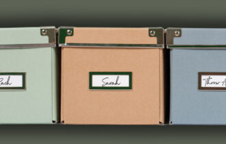 Three different colored storage boxes labeled by name.